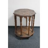 An octagonal carved oak occasional table