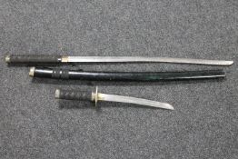 A Japanese samurai style sword and similar dagger