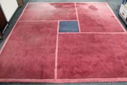 A contemporary rug on pink ground,