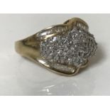 A 10ct gold ring set with diamonds, approximately 1ct.