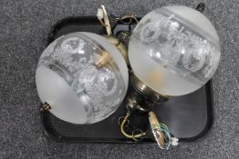 A pair of decorative frosted glass ceiling lights