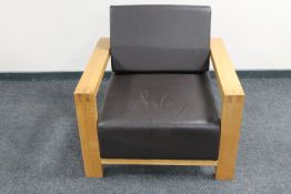 A contemporary oak framed armchair