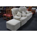 A contemporary three piece lounge suite comprising two seater settee,