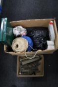 A box containing box of railway track, large ball of string, camping stove,
