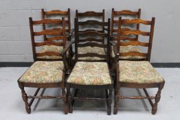 A set of six oak ladder back dining chairs