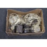 A box of vintage telephones