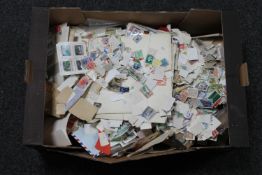 A box containing a very large quantity of loose stamps