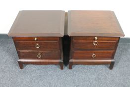 A pair of Stag Minstrel two drawer bedside chests