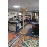 A bentwood hat and coat stand together with a metal and glass topped stool