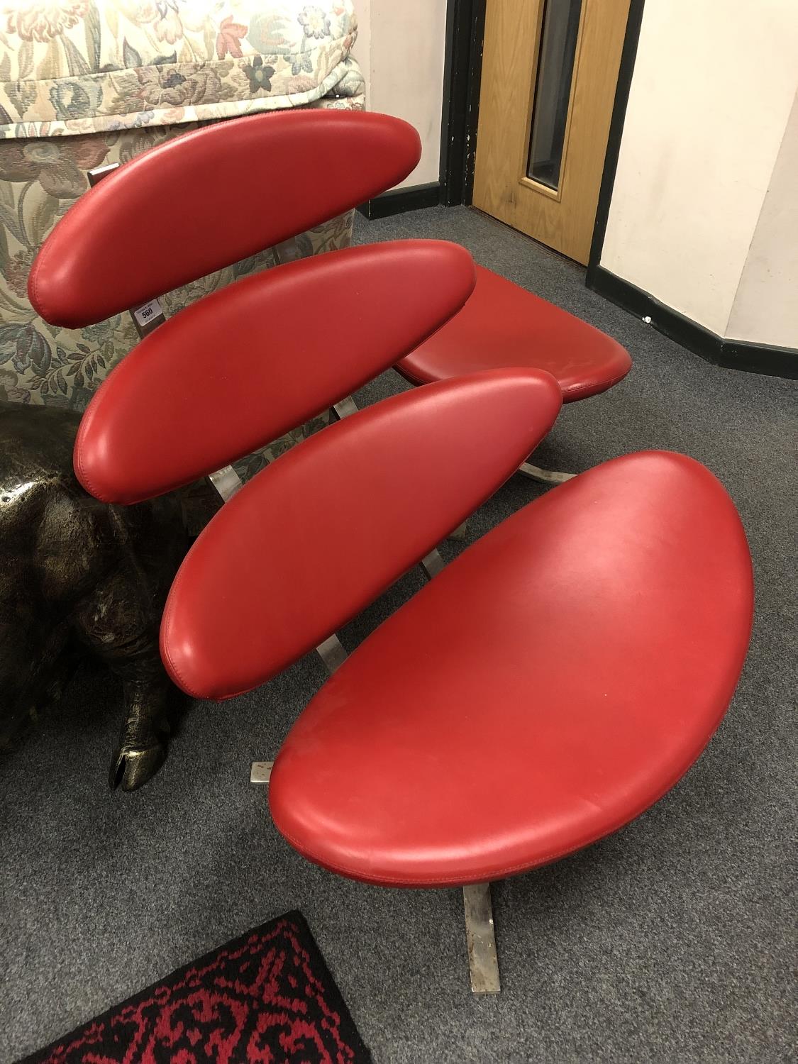 A contemporary red leather lounge chair with matching footstool CONDITION REPORT: - Image 2 of 8