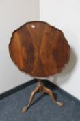 A mahogany tripod occasional table