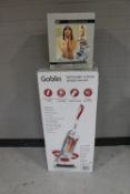 A boxed Goblin vacuum cleaner and a boxed Pro Airbrush tanning system