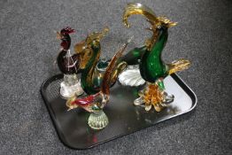 A tray of coloured glass cockerel ornaments