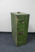 An antique green painted shipping trunk