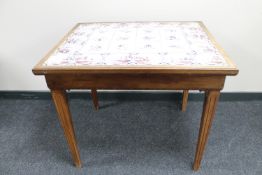 A continental mahogany tile topped table
