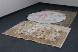 Three floral woollen rugs