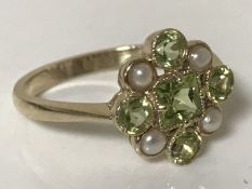 A 9ct gold peridot and pearl ring