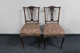 A pair of mahogany dining chairs on cabriole legs