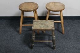 An oak cracket and two stools