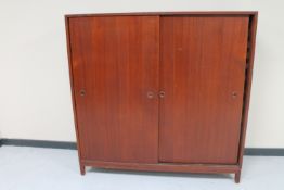 A mid 20th century Danish sliding door bookcase CONDITION REPORT: 148cm high by