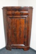 A 19th century continental mahogany corner cabinet