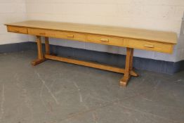 An oak five drawer library table,