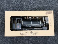 A boxed metal railway locomotive