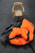 Two wooden child's chairs, three life jackets,