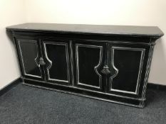 A painted contemporary four door sideboard
