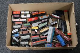 A box containing die cast Hornby and Lima rolling stock