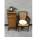 A bergere armchair and a trouser press