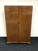 A 20th century inlaid mahogany gentleman's wardrobe