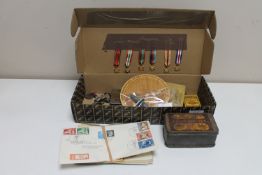 A collection Second World War items including tin of No.