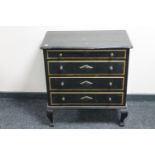 An antique pine painted four drawer chest