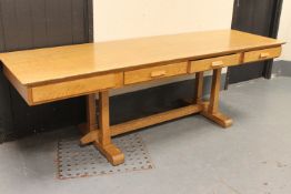 An oak four drawer library table,