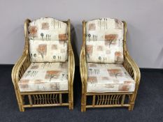 A pair of bamboo conservatory armchairs