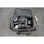 A camera bag containing Olympus OM-10 camera, Japanese Sigma-K lens,