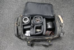 A camera bag containing Olympus OM-10 camera, Japanese Sigma-K lens,