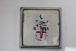 A vintage Institute of Medical Laboratory Technology car badge