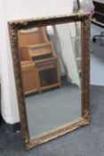 An ornate gilt framed mirror