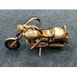 A hand-built wooden model of a motorcycle