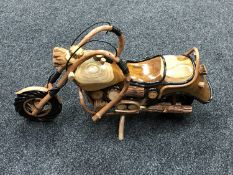 A hand-built wooden model of a motorcycle