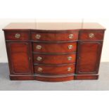 A mahogany Regency style bow-fronted sideboard