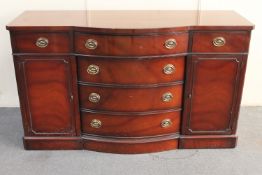 A mahogany Regency style bow-fronted sideboard