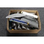 A box containing die cast rolling stock parts and components,