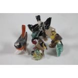 A Beswick bird figure and three Goebel bird figures