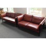 Two Danish stained beech framed settees upholstered in brown leather CONDITION REPORT: