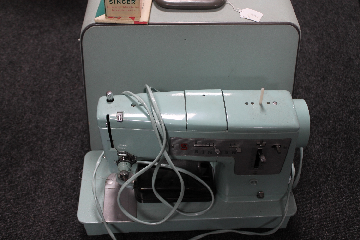 A cased 20th century Singer electric sewing machine