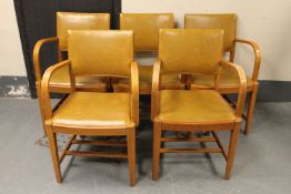 A set of five oak studded leather armchairs,