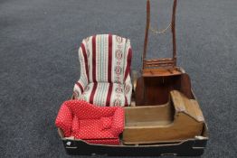 A box containing an early 20th century pine doll's crib together with an upholstered high backed